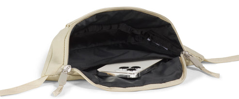 An open beige bag with a black interior and a smartphone inside.