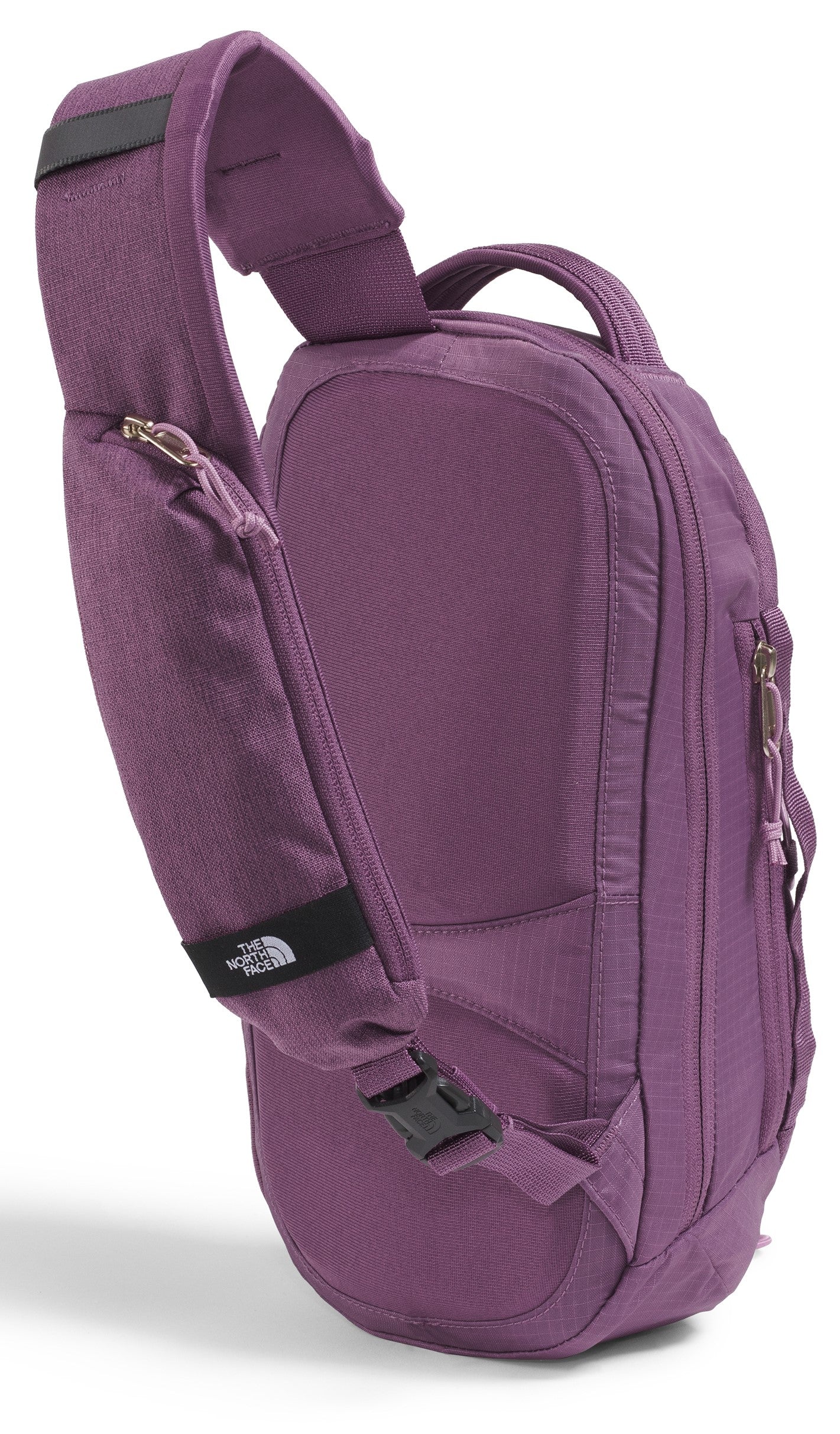 Purple sling backpack with an adjustable shoulder strap and several zippered compartments.