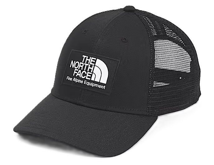 Black trucker hat with mesh back, featuring a white patch with black text and logo stating "THE NORTH FACE Fine Alpine Equipment".