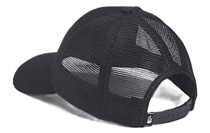 Black trucker hat with mesh back and adjustable strap.