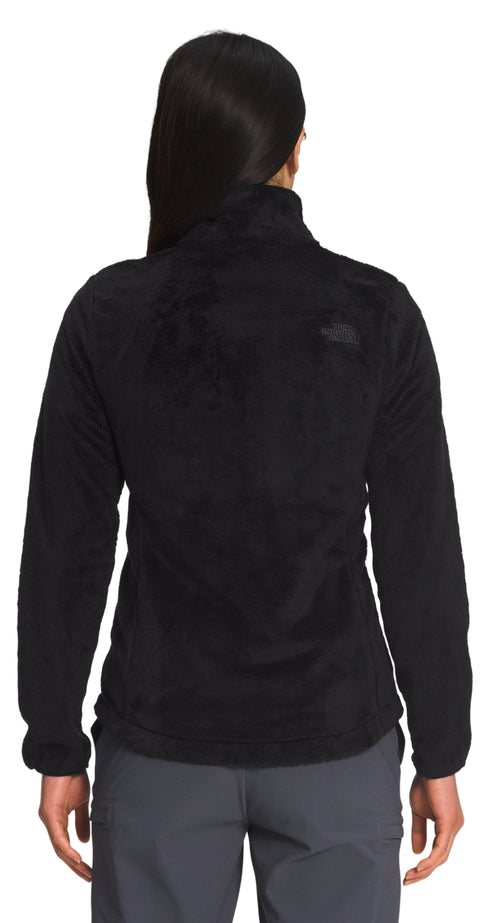 Person wearing a black fleece jacket, view from the back.