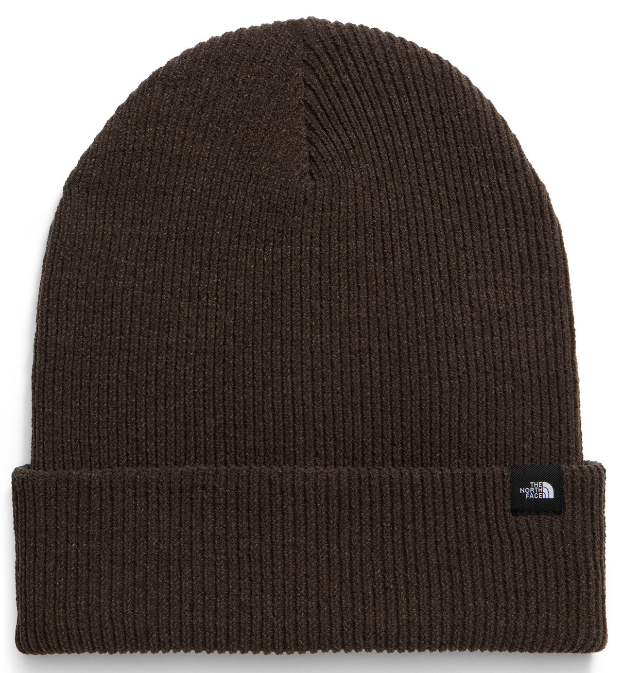 A dark brown, ribbed knit beanie with a folded cuff and a small black rectangular brand label on the right side.