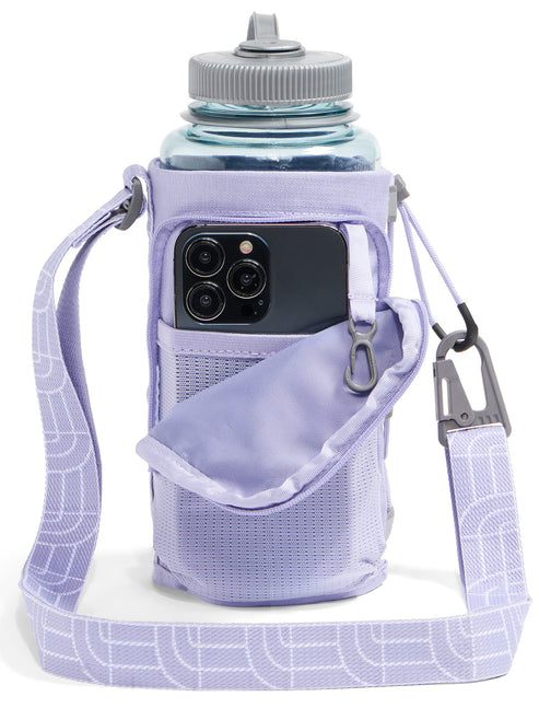 A light purple water bottle holder with a shoulder strap, featuring a front pouch that holds a smartphone and a small carabiner attached to the side.