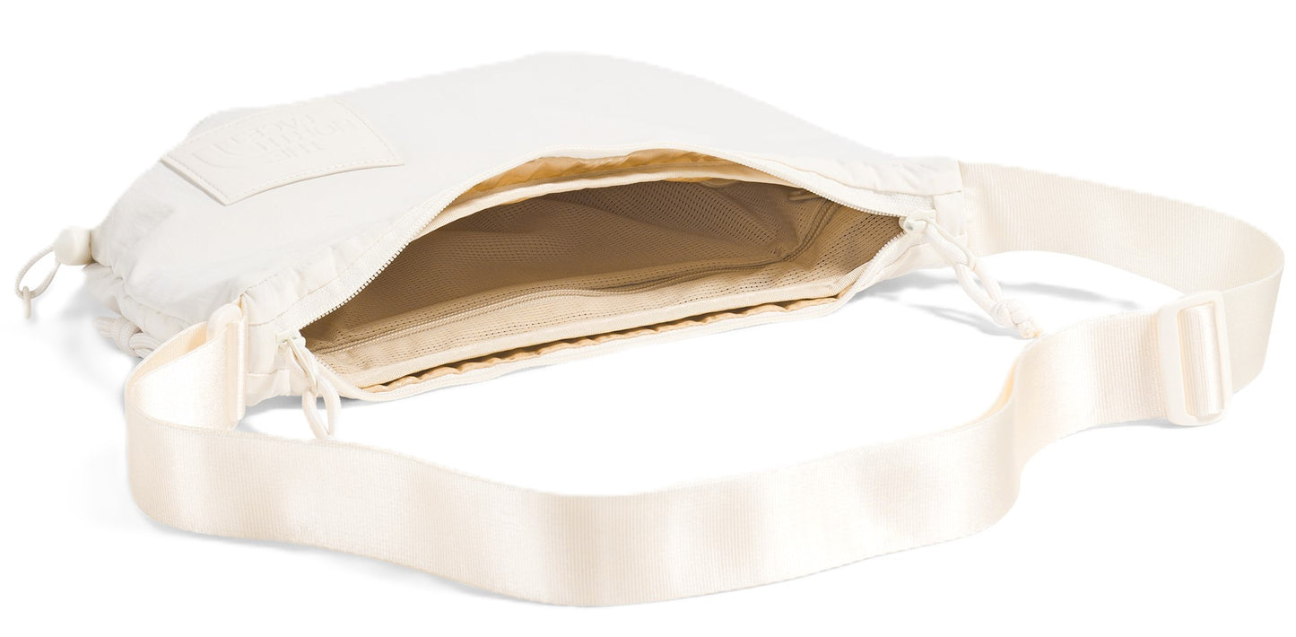 Open, white shoulder bag with a matching strap.