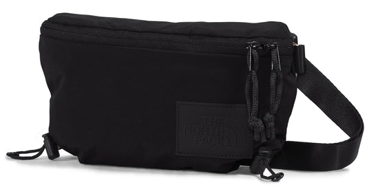 Black belt bag with zipper closure, cord details, and strap.