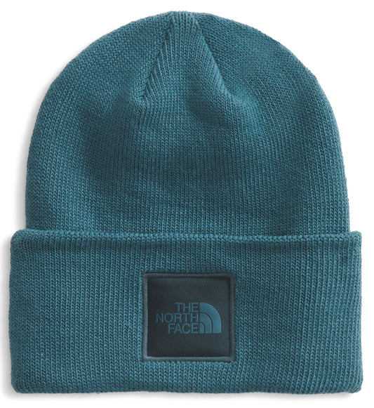 Teal beanie with a square patch saying "THE NORTH FACE".