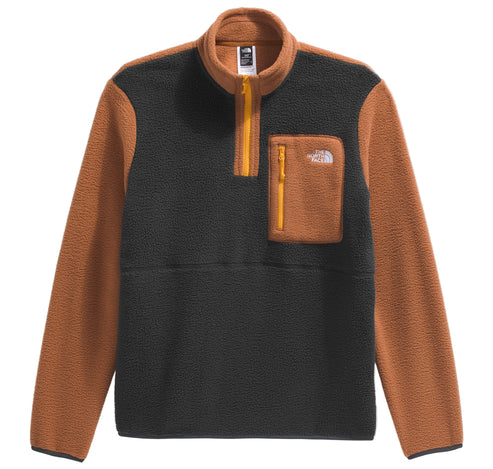 Half-zip long-sleeved sherpa pullover with orange sleeves and pocket, black torso.
