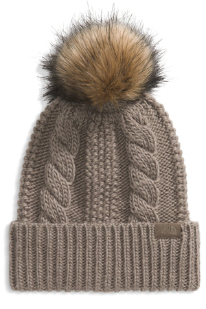 Knit beanie with cable design and faux fur pompom.