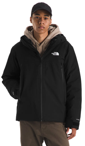 A man wearing a black hooded winter jacket over a tan hoodie, with a black baseball cap, front view.