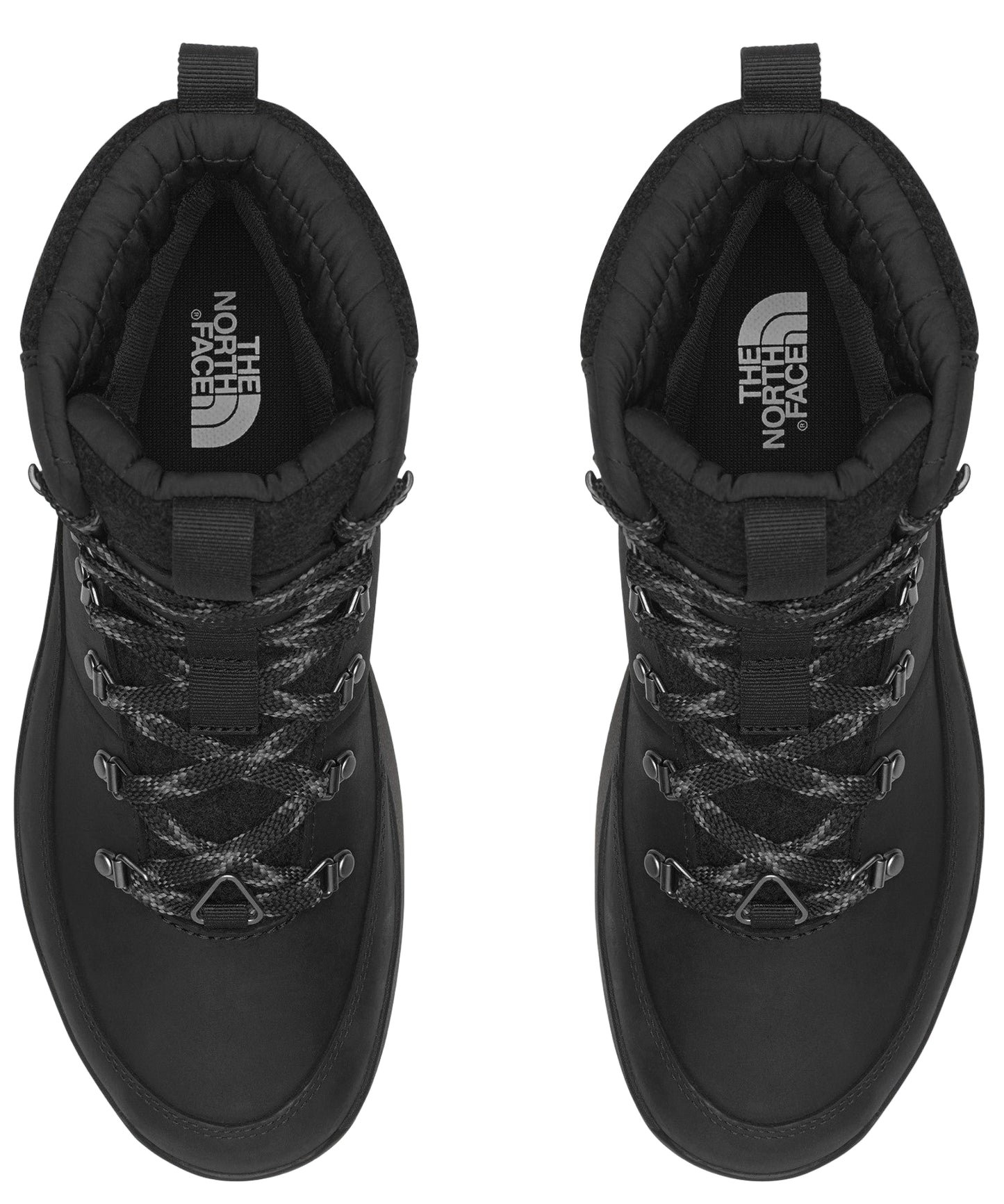 Two black, lace-up boots seen from above with The North Face logo visible on the insoles.
