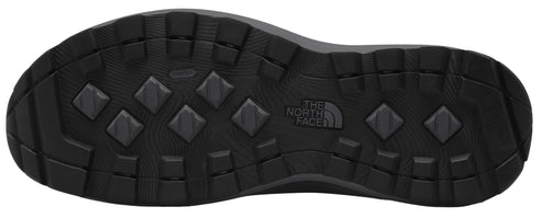 A black shoe sole with a diamond pattern and the logo of The North Face.