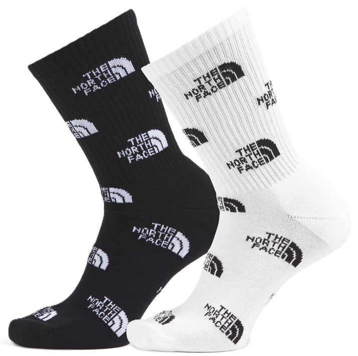 Pair of socks, one black and one white, each patterned with "THE NORTH FACE" text.