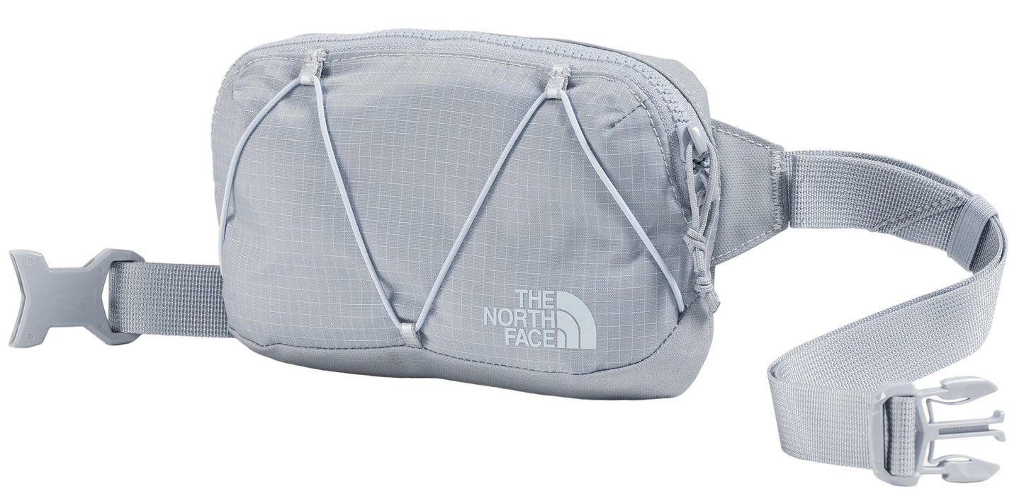 A gray waist bag with a bungee cord on the front and THE NORTH FACE logo.