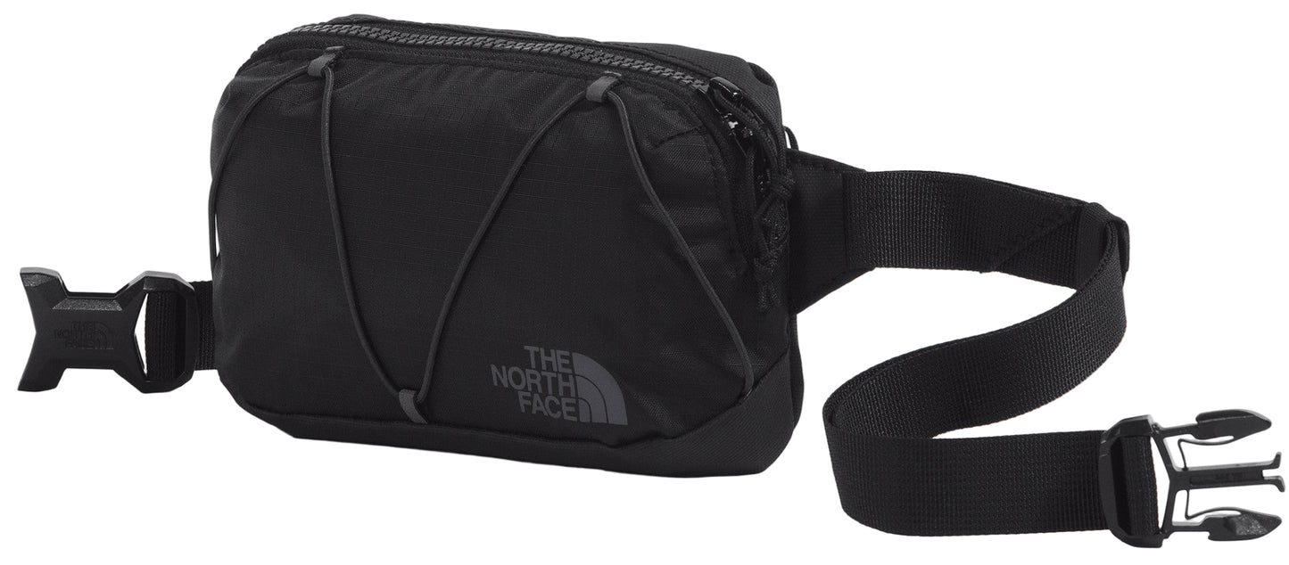 A black fanny pack with an adjustable strap and buckle closure.