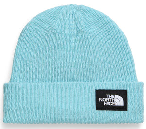 A light blue ribbed knit beanie featuring a black rectangular patch on the cuff with the text THE NORTH FACE in white.
