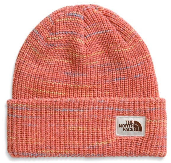 Pink ribbed beanie with a small white logo patch at the brim.