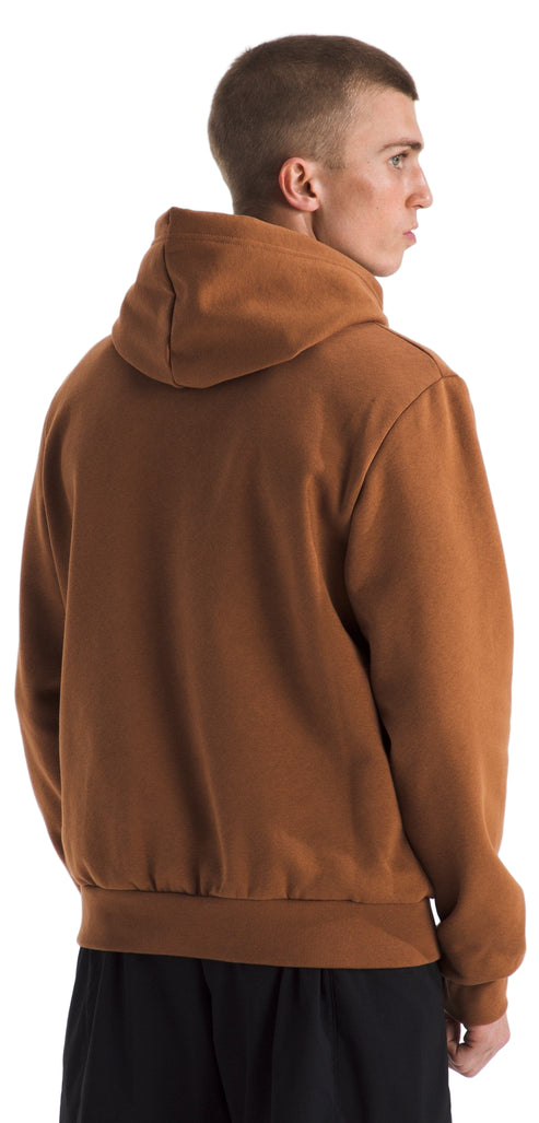 A man wearing a brown hoodie from the back.