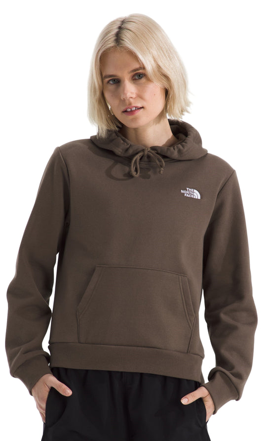 Woman wearing a brown hooded sweatshirt with drawstrings and a kangaroo pocket.
