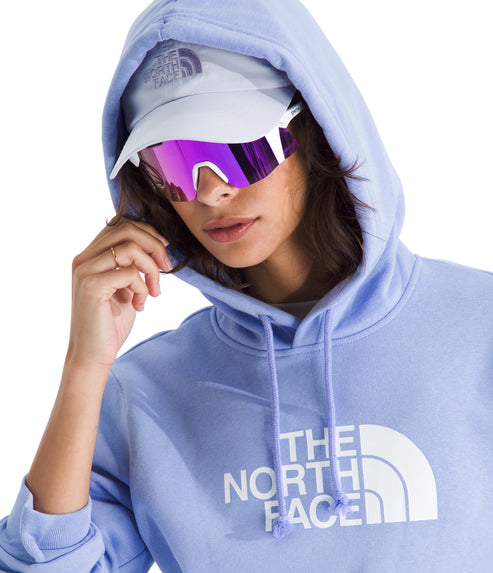 Person wearing a light purple hoodie with "THE NORTH FACE" printed on it, light gray hat, and futuristic purple sunglasses.