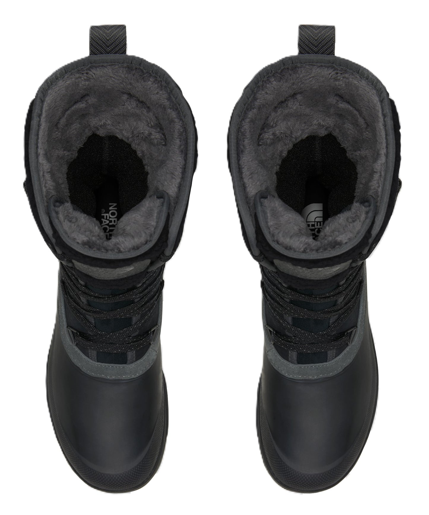 A top-down view of a pair of black, calf-height winter boots with a fuzzy, dark grey faux-fur lining, lace-up fronts, and rounded toes.