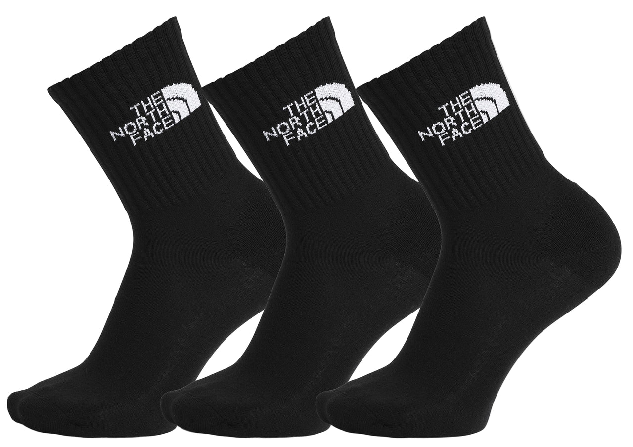 Three black socks with a white logo reading "THE NORTH FACE".