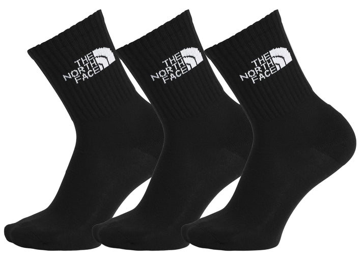 Three black socks with a white logo reading "THE NORTH FACE".