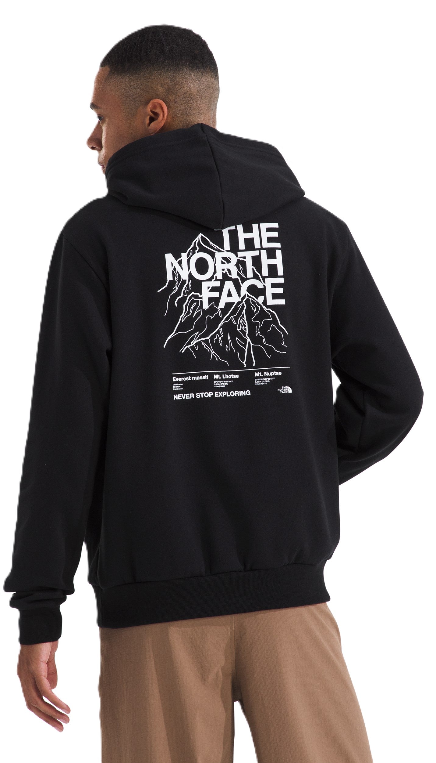 Back view of a person wearing a black hooded sweatshirt, featuring a mountain graphic with the text "THE NORTH FACE" above and "NEVER STOP EXPLORING" below.