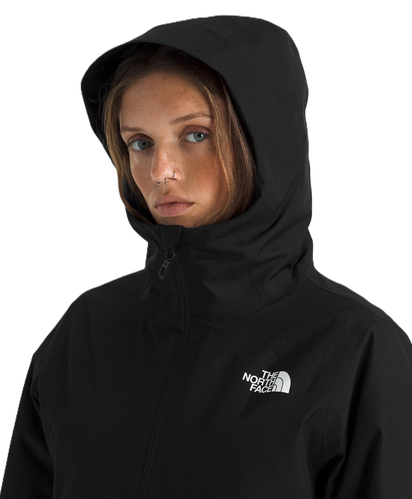 A woman wearing a black, hooded, long-sleeved, high-neck windbreaker jacket with the white "The North Face" logo visible on the upper chest.