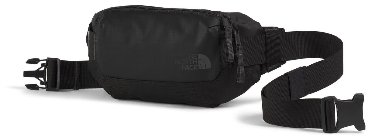 A black fanny pack with an adjustable black strap and black buckles.