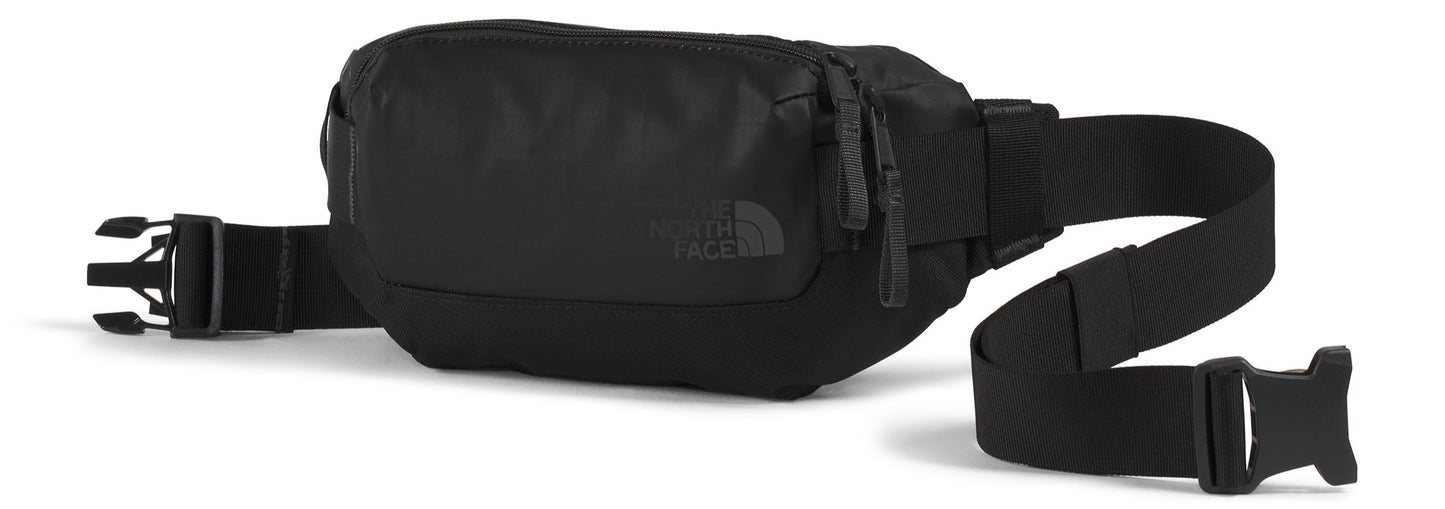 A black fanny pack with an adjustable black strap and black buckles.