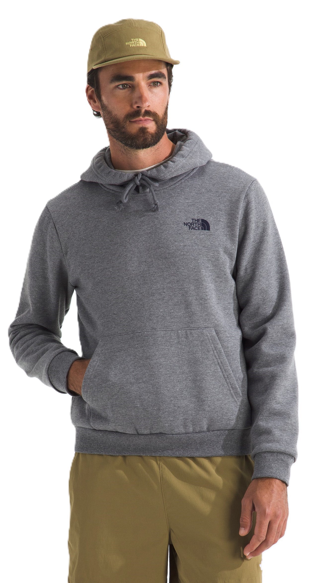 Man in gray hoodie and khaki hat with logo on the chest.