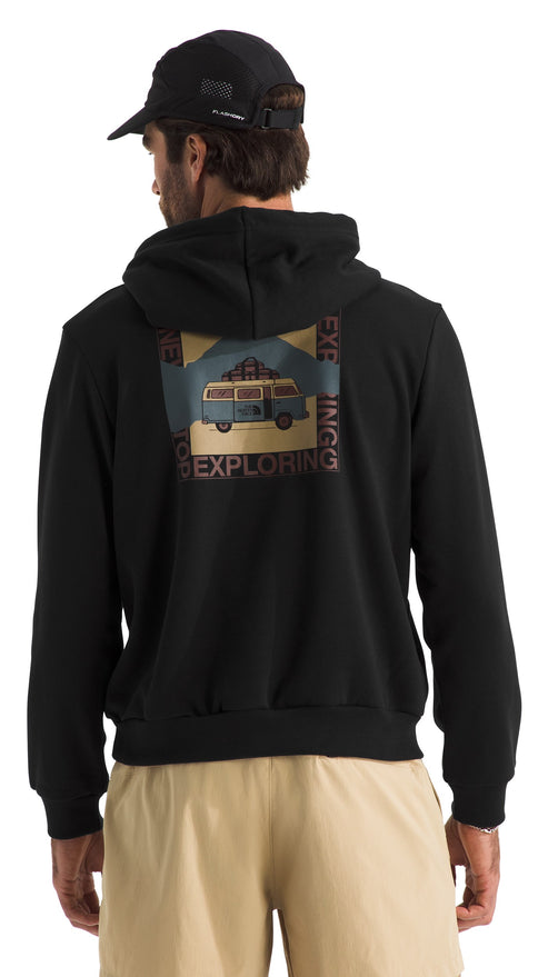Man facing back wearing a black hoodie with a graphic of a van and nature scene, with the words "Exploring" and "Adventuring" surrounding the graphic.