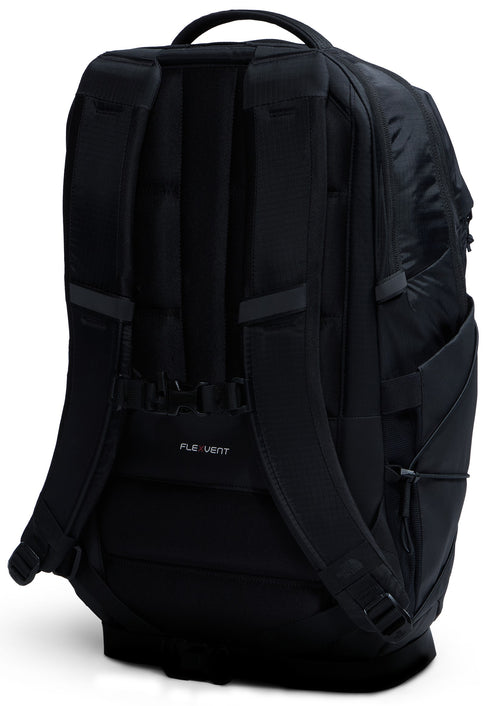 A black backpack shown from the rear view, featuring padded shoulder straps with a sternum strap, a top carry handle, and a FlexVent back panel.