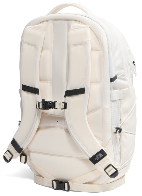 The back view of an off-white backpack featuring padded shoulder straps with an adjustable chest strap, a padded back panel with horizontal segments, and adjustable waist straps at the bottom.
