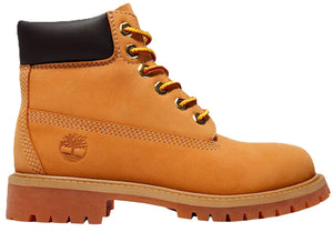 A classic wheat-colored nubuck leather work boot with a padded black leather ankle collar, brass eyelets, yellow and orange striped laces, a thick lugged gum-colored outsole, and a tree logo embossed on the side heel.