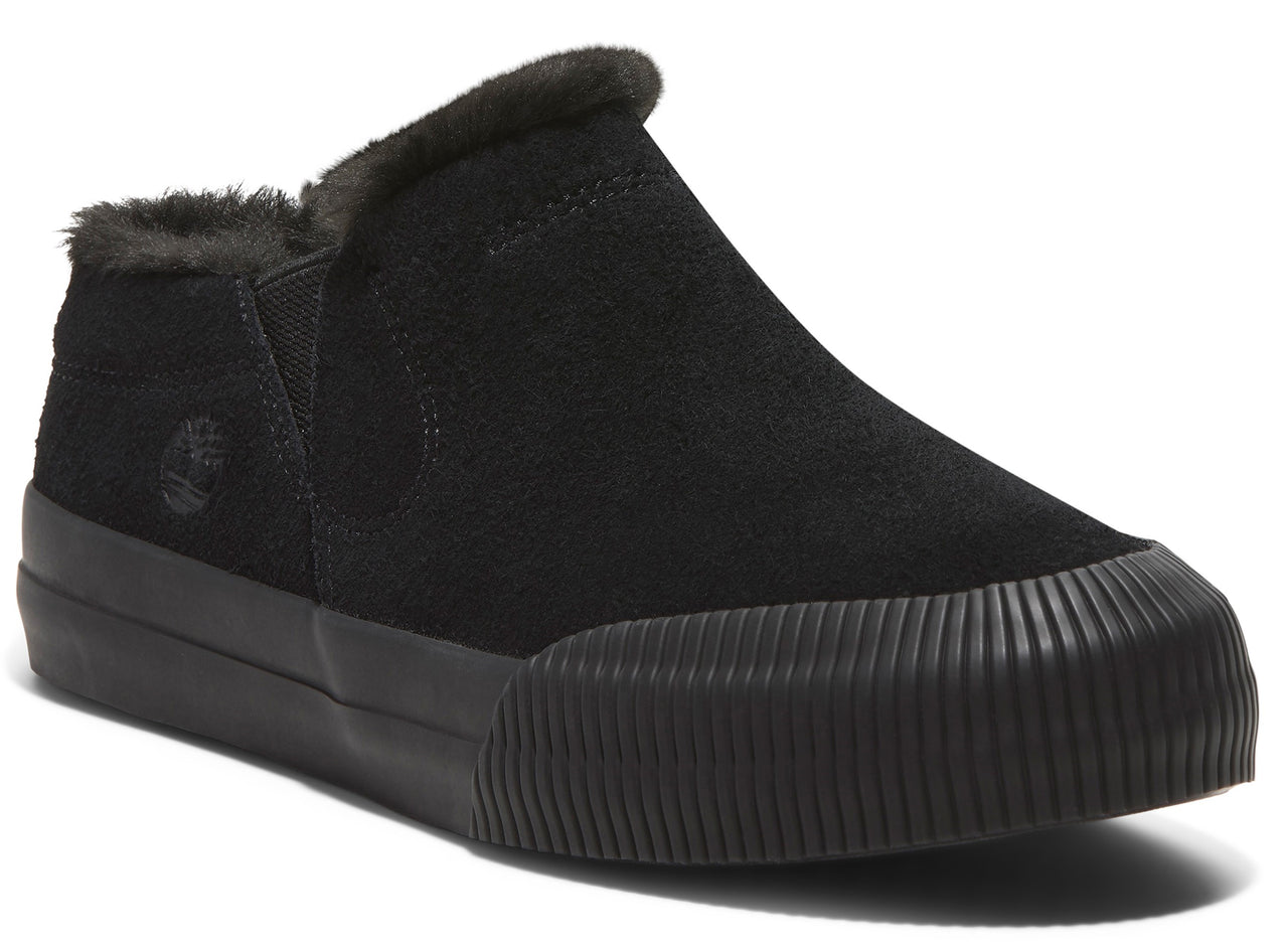 A black suede slip-on shoe with a black ridged sole and faux fur lining.