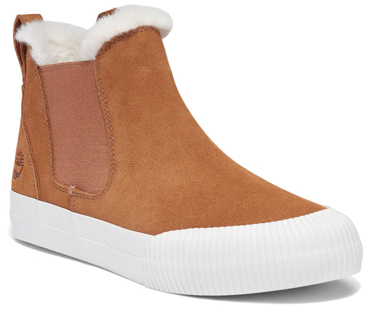 Tan suede Chelsea boot with white rubber sole and faux fur trim.