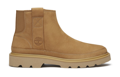 A tan Chelsea style boot with a lug sole.