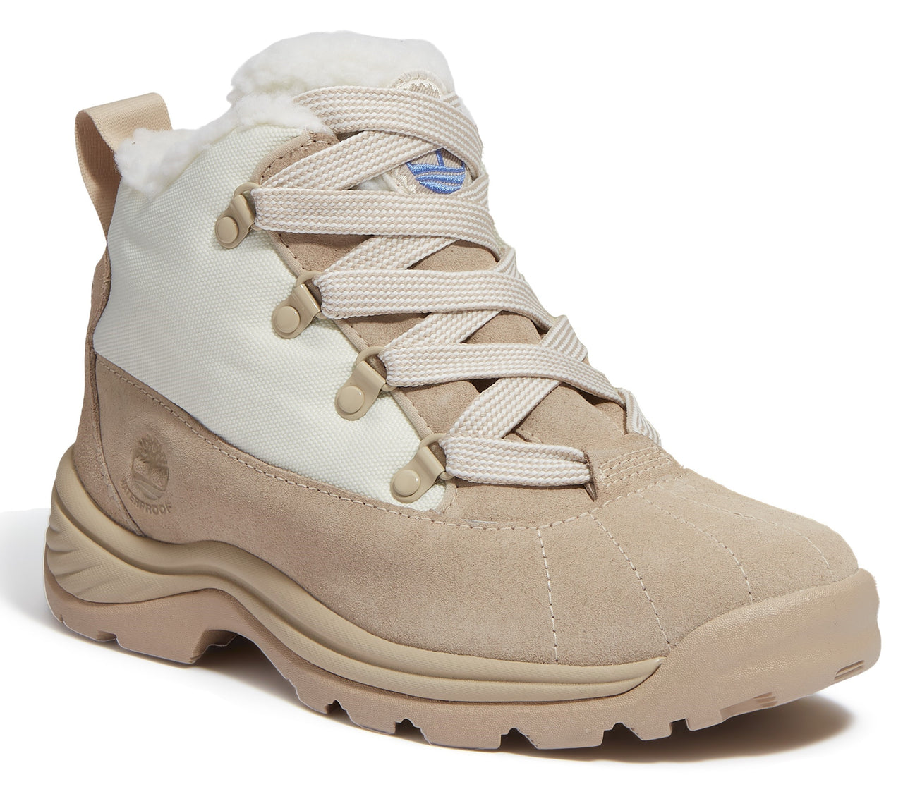 Beige suede boot with off-white fabric trim, a faux fur lining, and beige laces.