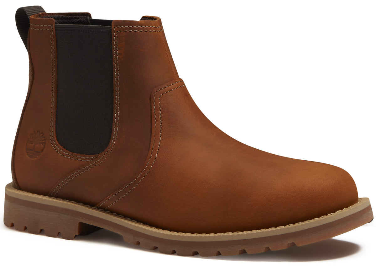 A brown leather Chelsea boot with a black elastic side panel, a pull tab at the heel, and a thick tan lugged sole.