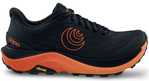 Black running shoe with an orange logo, midsole, and outsole; 'topo' is visible on the heel and 'vibram' is visible on the side of the midsole.