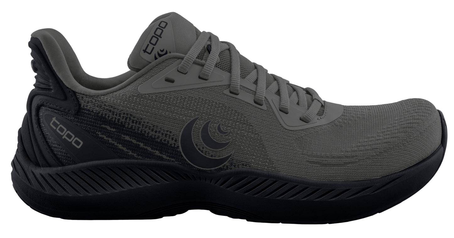 Gray athletic shoe with black sole and Topo logo.