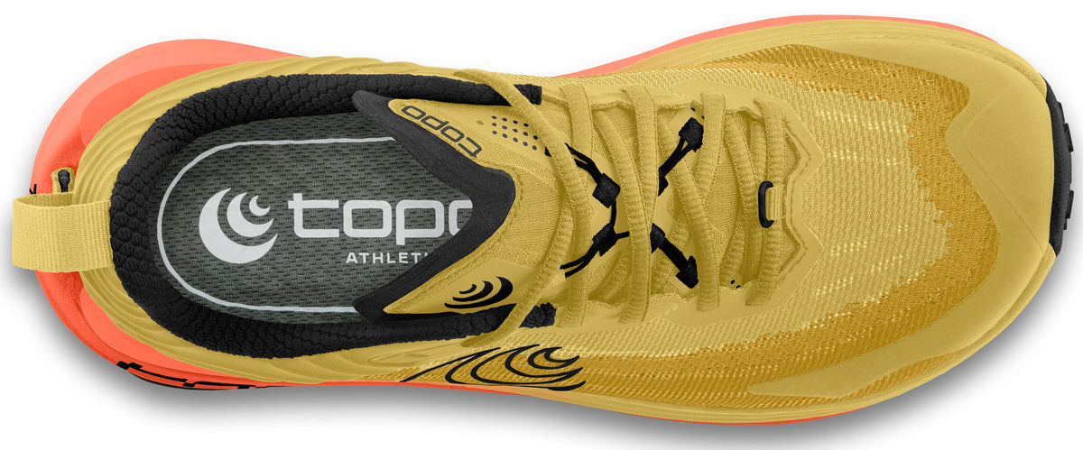Yellow running shoe with black laces and visible topo athletic logo.