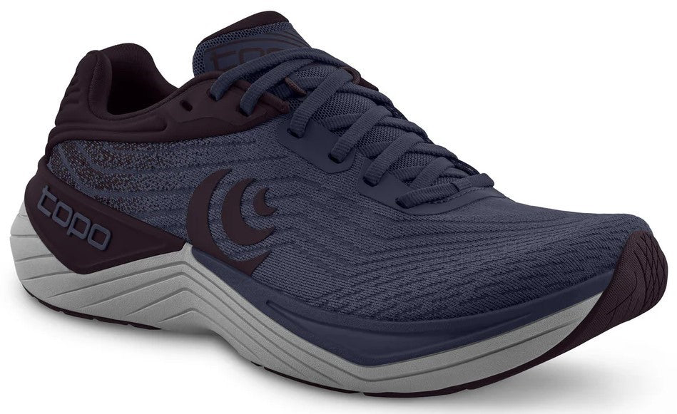 A navy running shoe with a gray sole, dark purple heel and a crescent logo on the side.