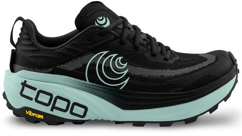 Black running shoe with teal accents, featuring the text "topo" and "Vibram" on the sole, and a spiral logo on the side.