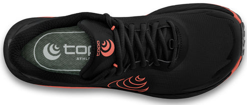 Top-down view of a black running shoe with orange accents, showcasing its laces and insole with the brand logo.