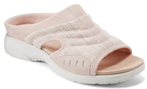 A light pink slide sandal with a textured upper and white sole.