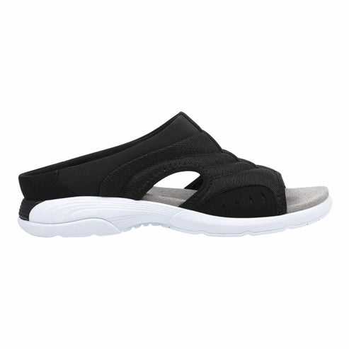 Black slide sandal with a white sole.