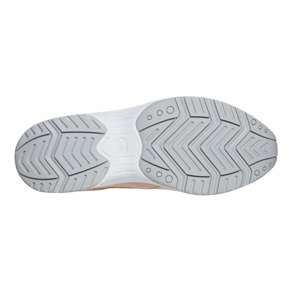 Outsole of a shoe with a zig-zag pattern and round indentations.