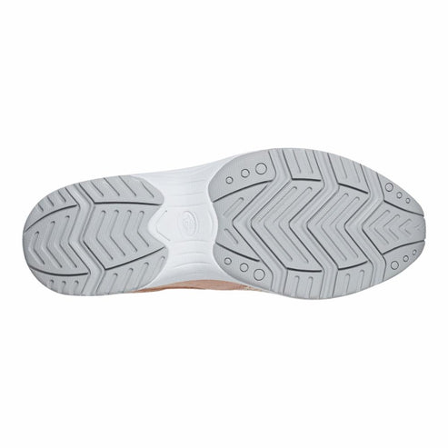 Outsole of a shoe with a zig-zag pattern and round indentations.